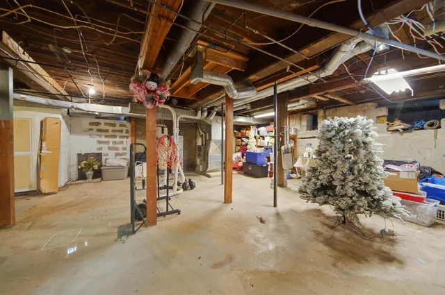 a living room with furniture a rug and a table