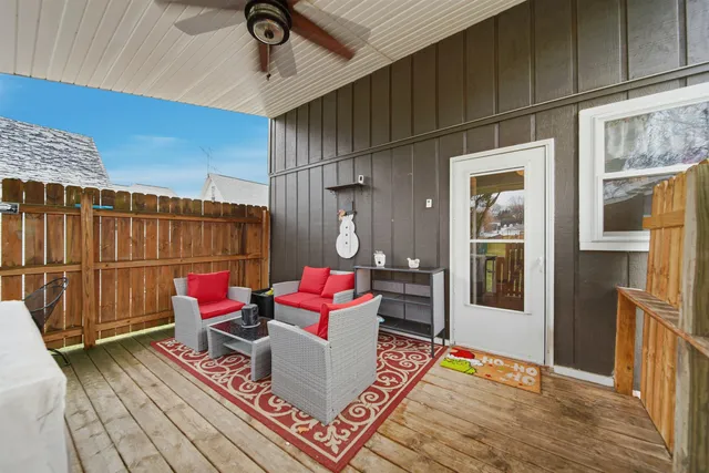 a view of a house with a yard and deck