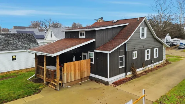 a aerial view of a house with a yard
