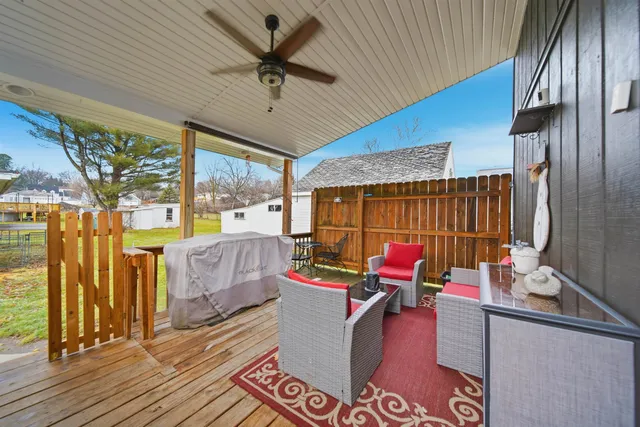 a reading room with furniture and a flat screen tv