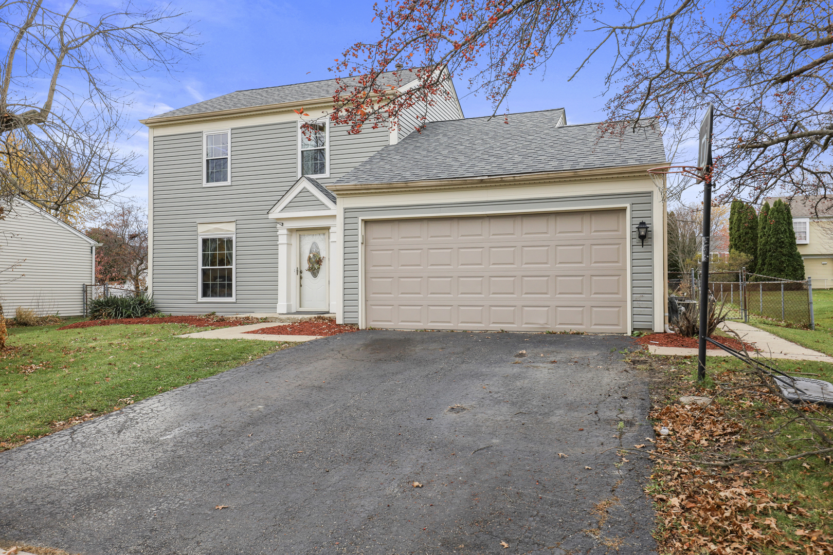 1475 Farrington Lane Aurora, IL 60504 - Photo 1 of 45 a front view of a house with a yard and garage