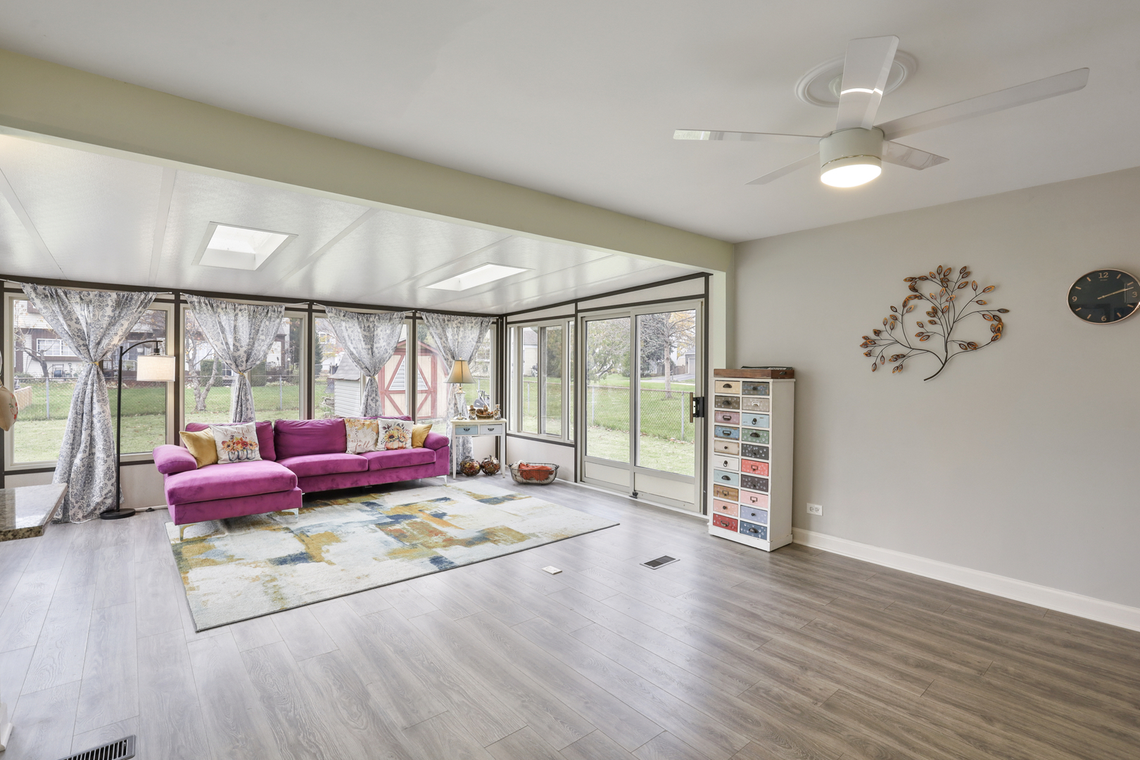 1475 Farrington Lane Aurora, IL 60504 - Photo 15 of 45 a living room with furniture floor to ceiling window and wooden floor