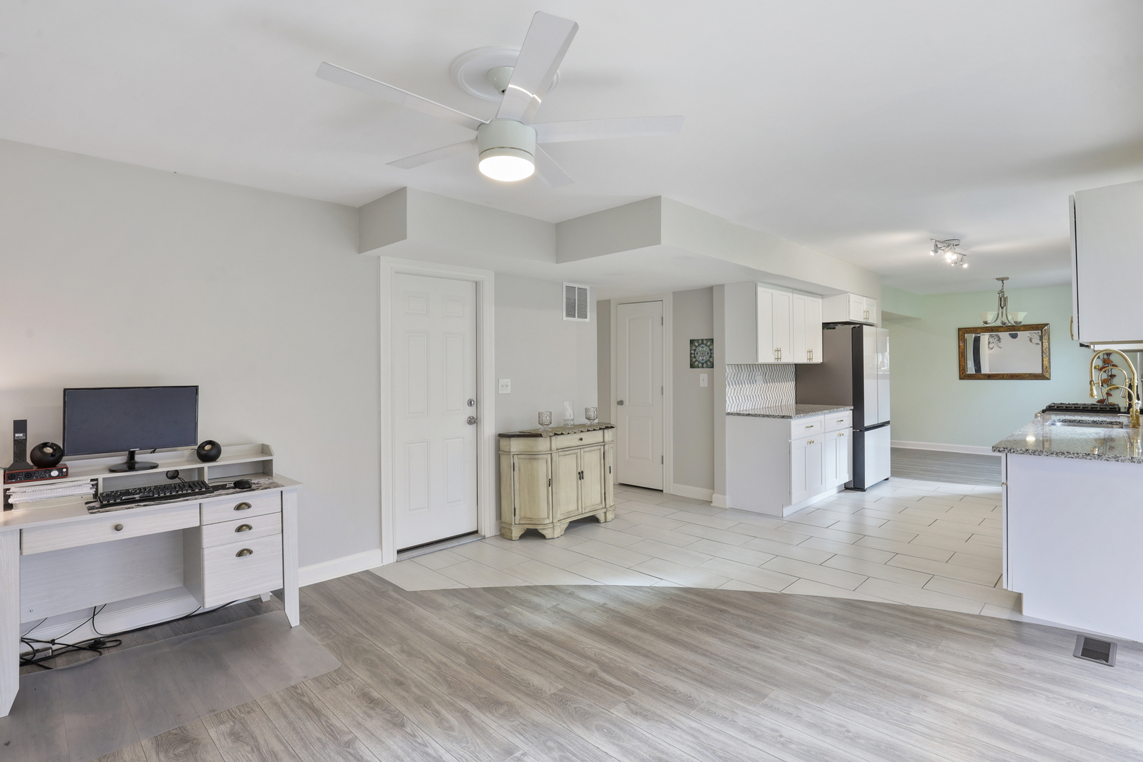 1475 Farrington Lane Aurora, IL 60504 - Photo 17 of 45 a large white kitchen with a stove a sink dishwasher and a refrigerator with wooden floor