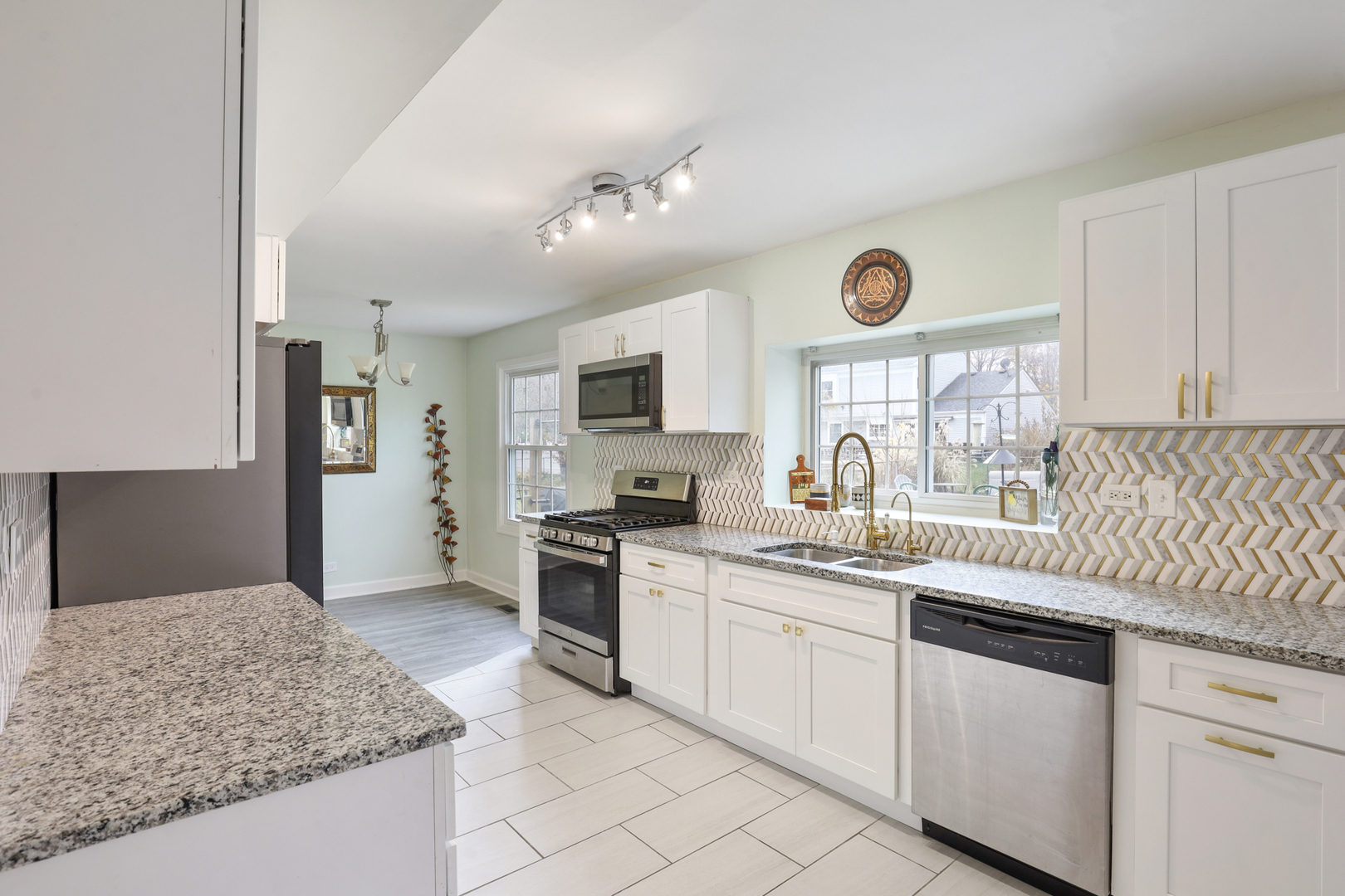 1475 Farrington Lane Aurora, IL 60504 - Photo 18 of 45 a kitchen with stainless steel appliances granite countertop a sink dishwasher stove and refrigerator