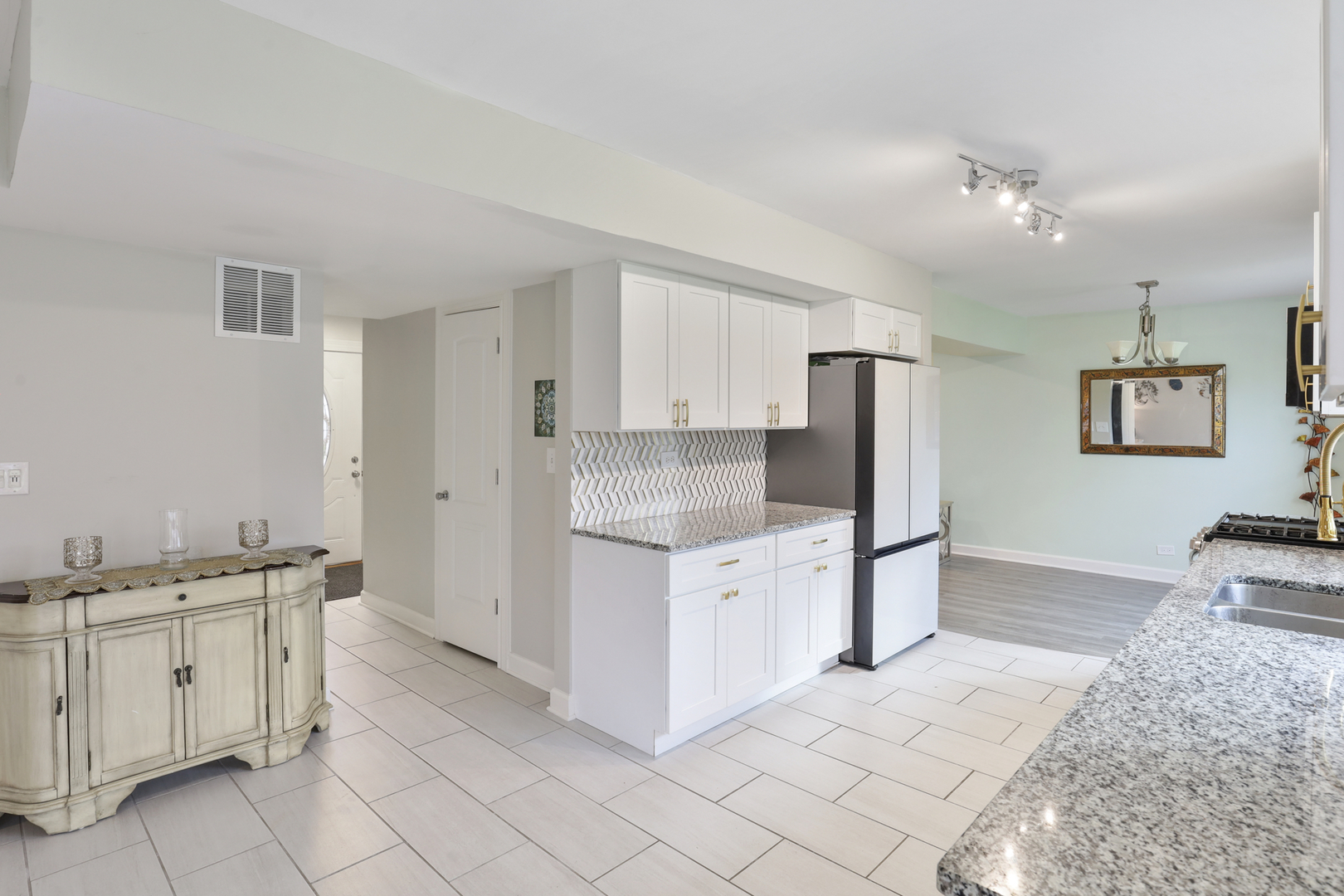 1475 Farrington Lane Aurora, IL 60504 - Photo 20 of 45 a kitchen with white cabinets and sink