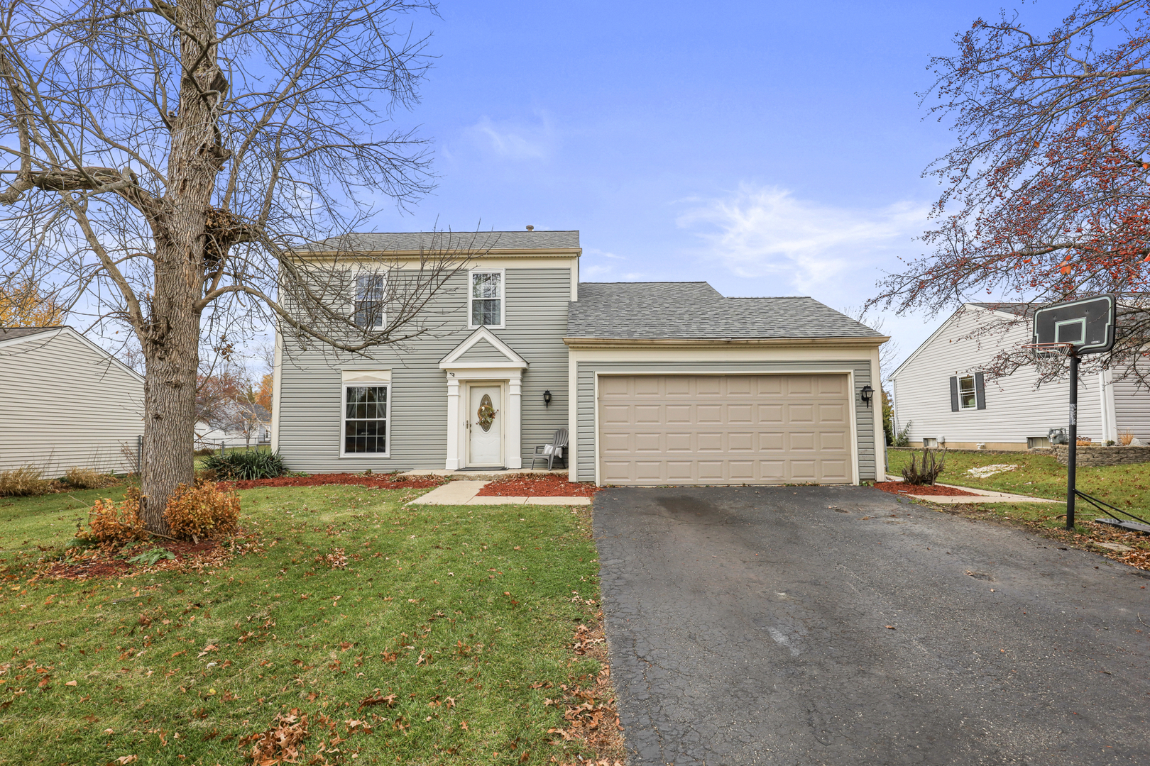 1475 Farrington Lane Aurora, IL 60504 - Photo 2 of 45 a front view of a house with a yard and garage