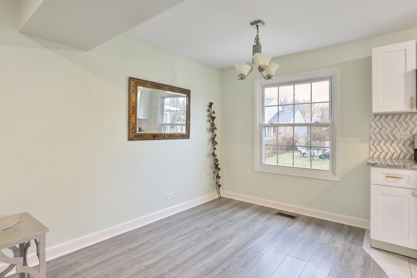 1475 Farrington Lane Aurora, IL 60504 - Photo 24 of 45 a view of an empty room with wooden floor and a window