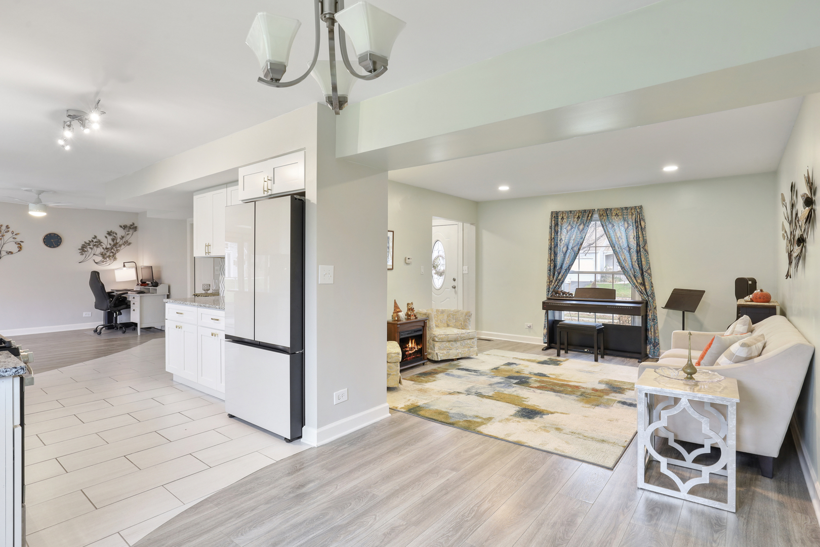1475 Farrington Lane Aurora, IL 60504 - Photo 25 of 45 a living room with furniture a rug and kitchen view