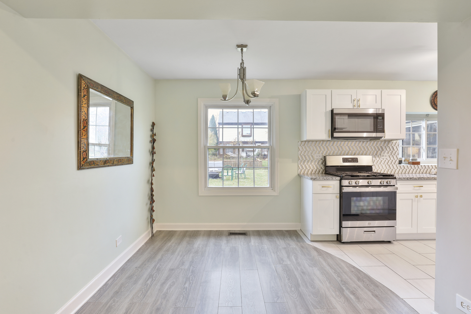 1475 Farrington Lane Aurora, IL 60504 - Photo 27 of 45 a kitchen with granite countertop a stove and a wooden floors