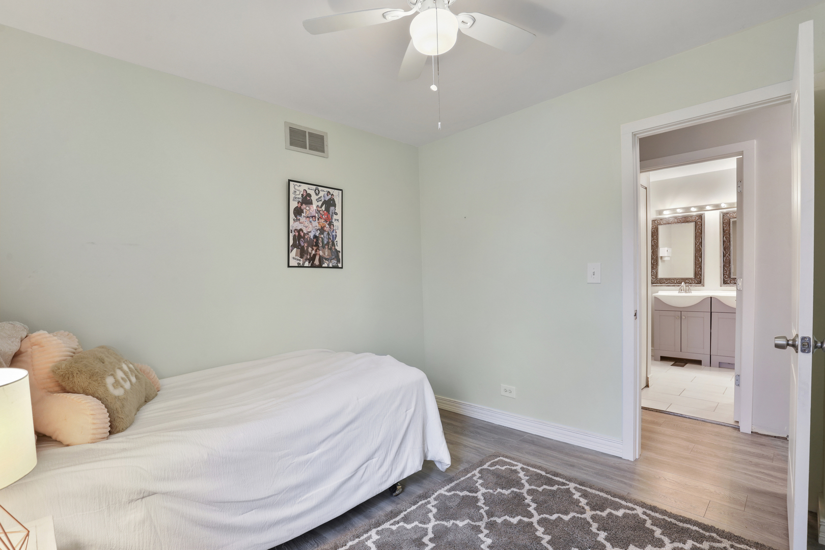 1475 Farrington Lane Aurora, IL 60504 - Photo 33 of 45 a bedroom with a bed and a painting on the wall