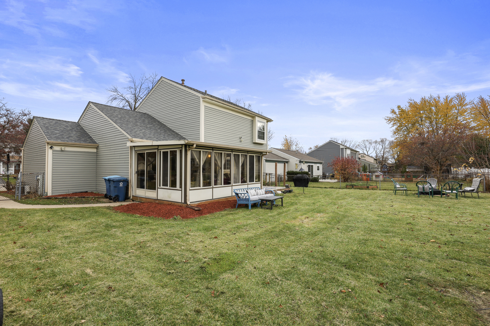 1475 Farrington Lane Aurora, IL 60504 - Photo 5 of 45 a view of a house with a big yard and large trees