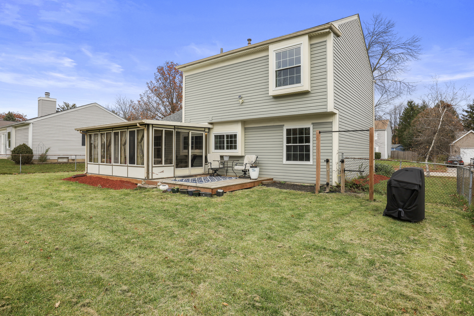 1475 Farrington Lane Aurora, IL 60504 - Photo 7 of 45 a view of a house with backyard and porch
