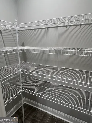 a kitchen with granite countertop sink and cabinets