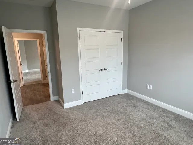 an empty room with mirror