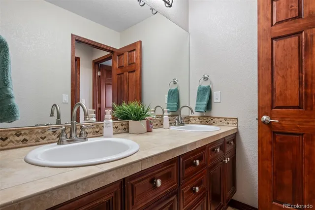 a bathroom with a sink and a mirror