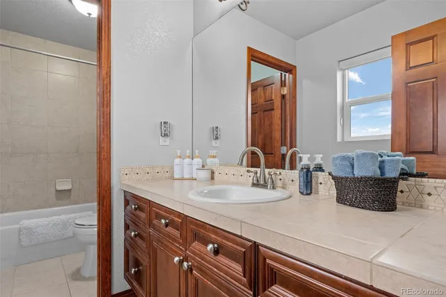 a bathroom with a double vanity sink mirror and double