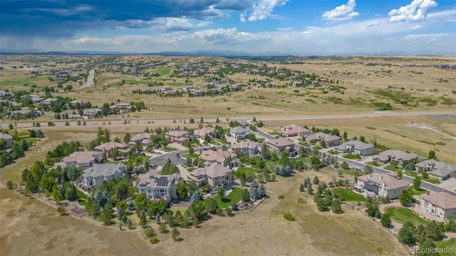 an aerial view of a house with a swimming pool