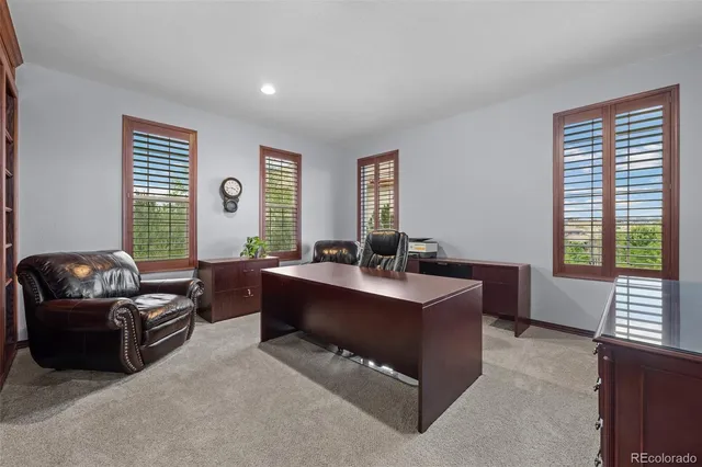a living room with furniture and windows