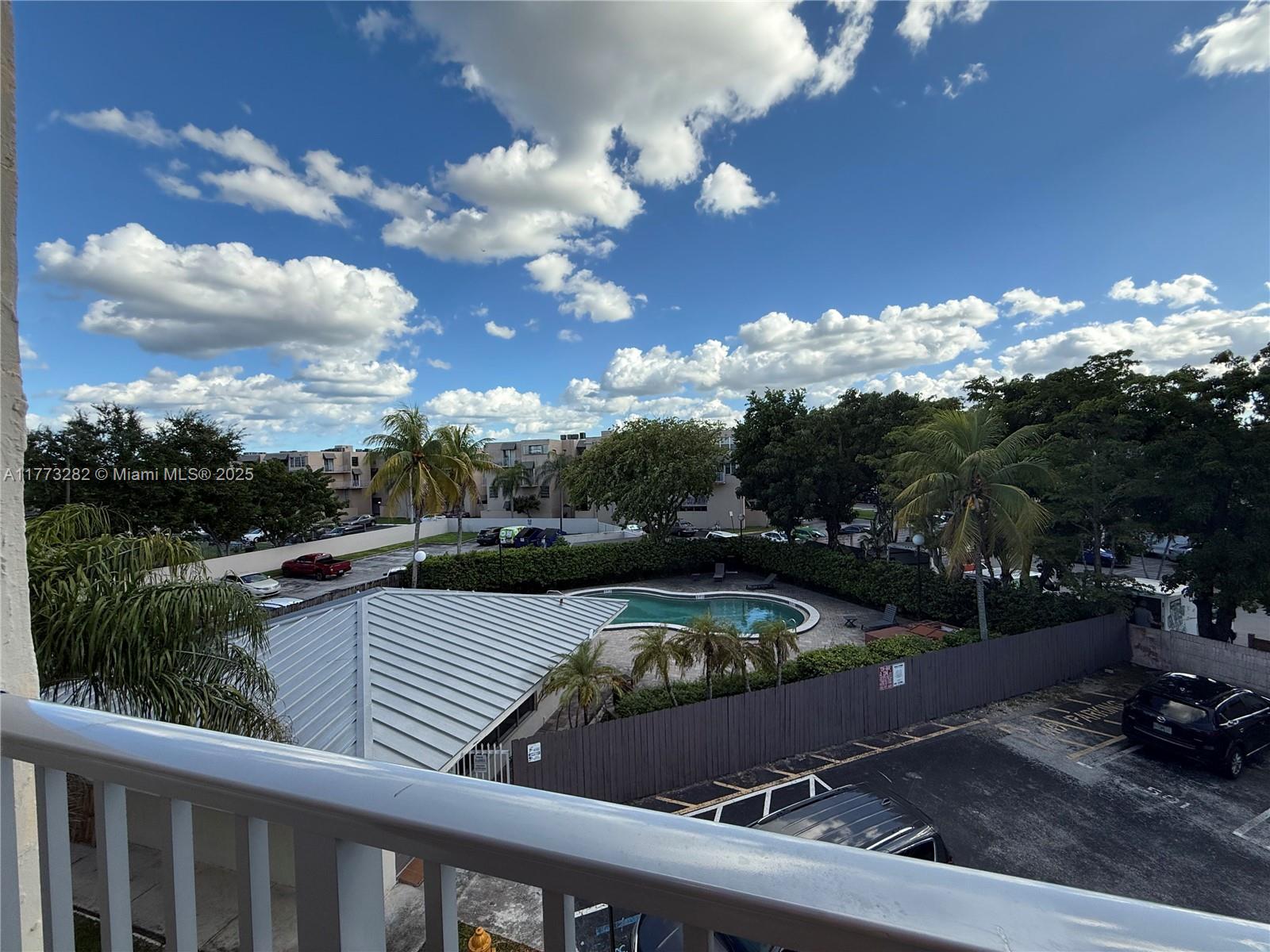 a view of a swimming pool from a balcony