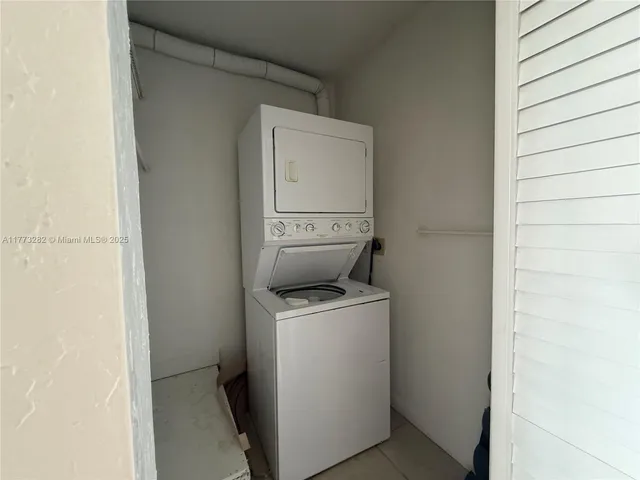a view of bathroom with a washer and dryer