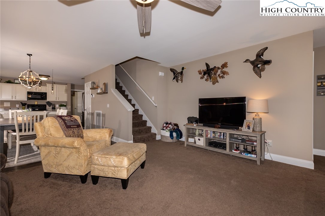 351 Colony Lane Purlear, NC 28665 - Photo 19 of 39 a living room with furniture and a flat screen tv