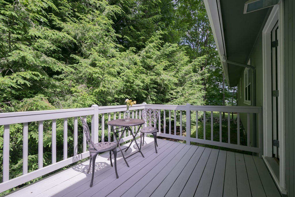 75 Reed Street Lexington, MA 02421 - Photo 29 of 30 a view of a wooden deck with a yard