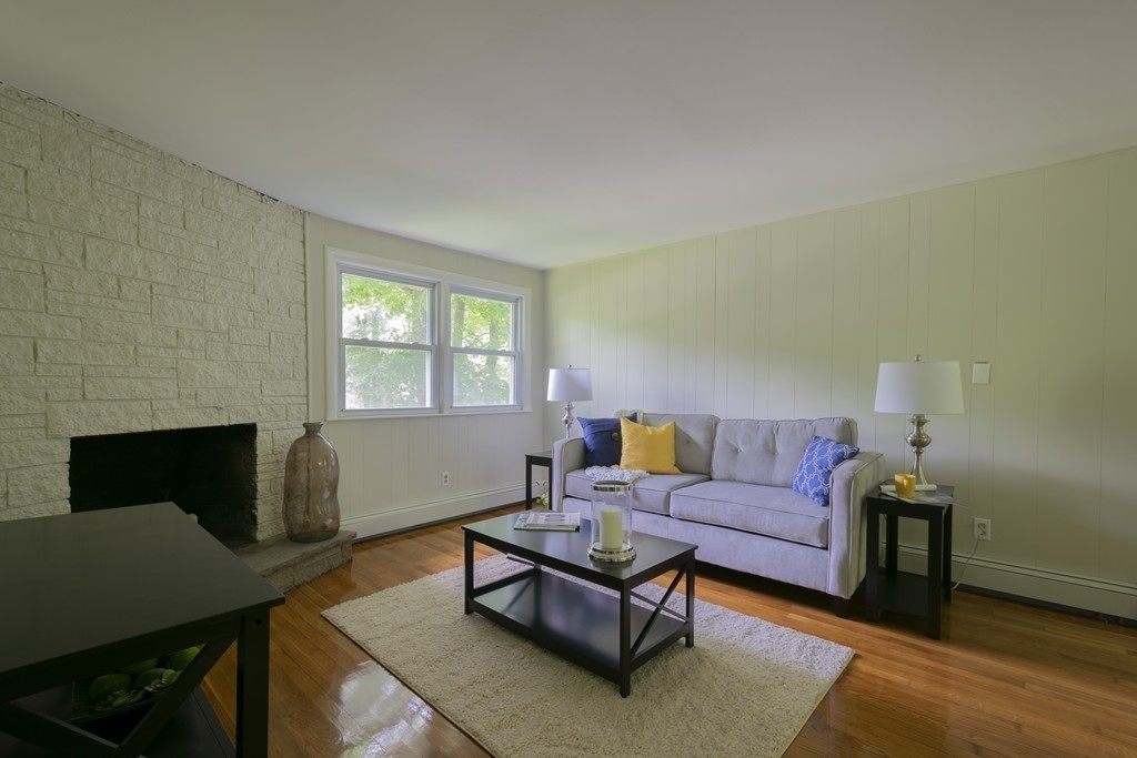 75 Reed Street Lexington, MA 02421 - Photo 3 of 30 a living room with furniture fireplace and a window
