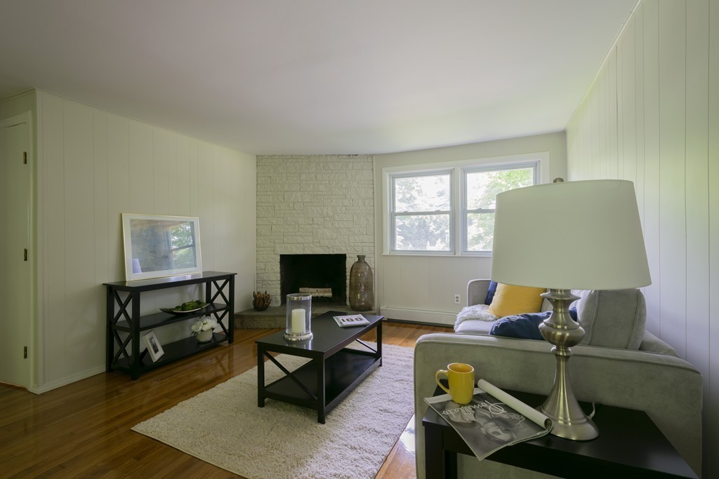 75 Reed Street Lexington, MA 02421 - Photo 4 of 30 a living room with furniture and a wooden floor