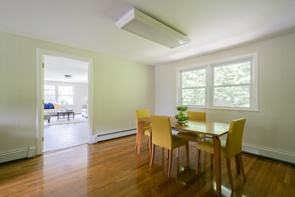 75 Reed Street Lexington, MA 02421 - Photo 7 of 30 a view of a dining room with furniture and wooden floor