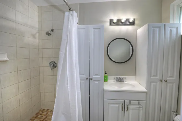 an empty room with wooden floor and a window