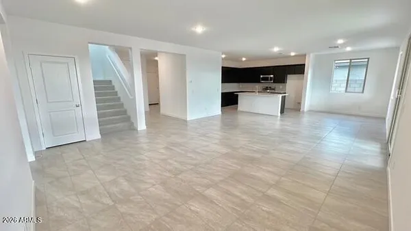 a kitchen that has a sink and a stove in it