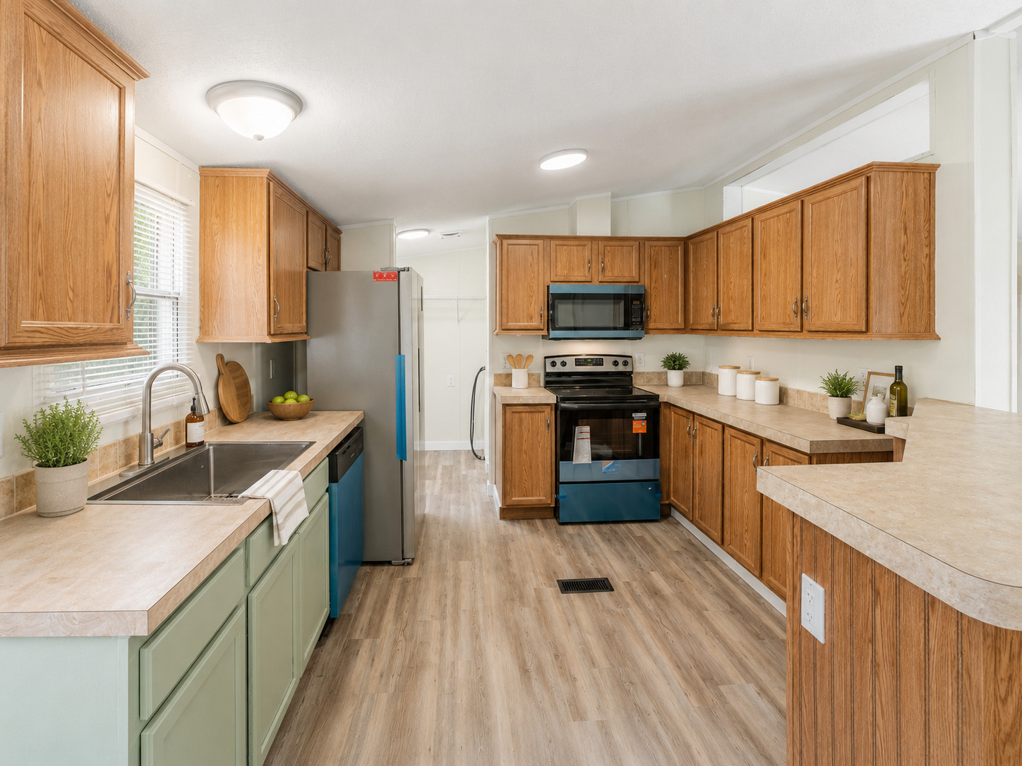 171 Railyard Drive Kyle, TX 78640 - Photo 7 of 20 a kitchen with stainless steel appliances granite countertop a sink stove and refrigerator