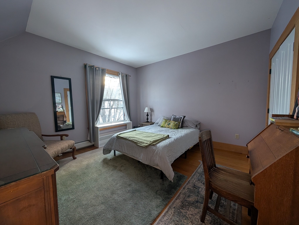 527 Main Street, Unit 1 Ashfield, MA 01330 - Photo 12 of 24 a bedroom with a bed and a window