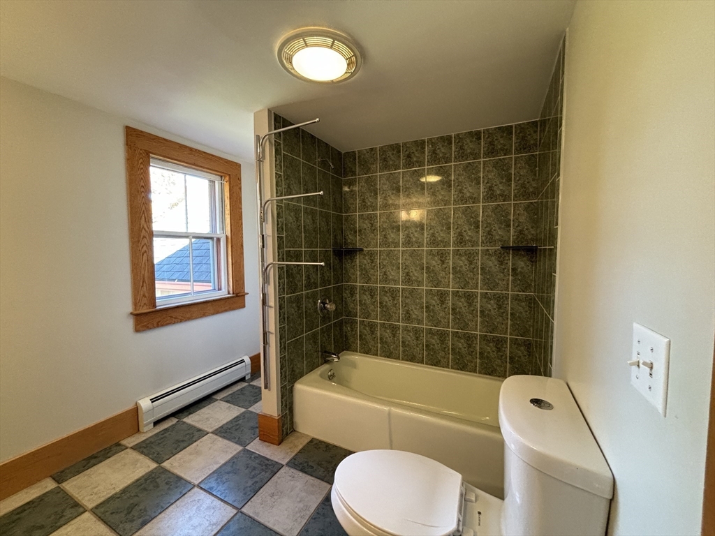 527 Main Street, Unit 1 Ashfield, MA 01330 - Photo 13 of 24 a bathroom with a toilet and bathtub