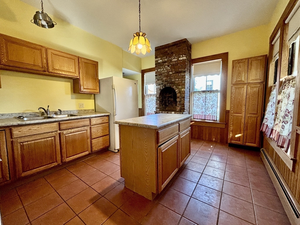 527 Main Street, Unit 1 Ashfield, MA 01330 - Photo 2 of 24 a kitchen with stainless steel appliances granite countertop a stove a sink dishwasher and a refrigerator