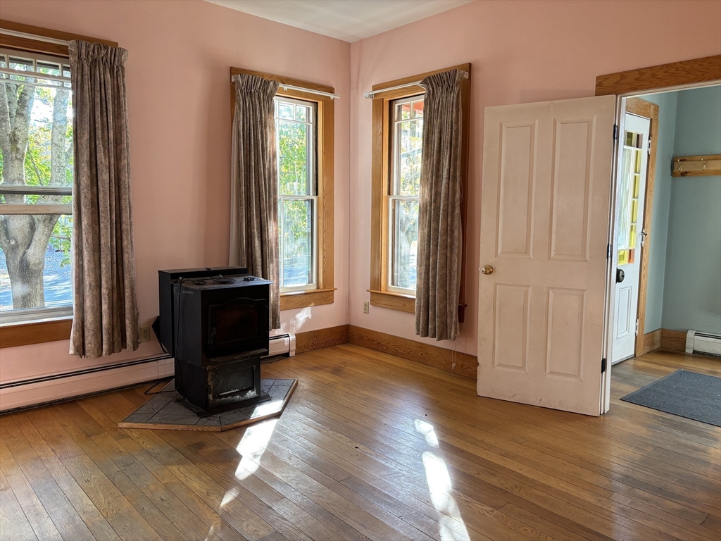 527 Main Street, Unit 1 Ashfield, MA 01330 - Photo 7 of 24 a view of room with window and wooden floor