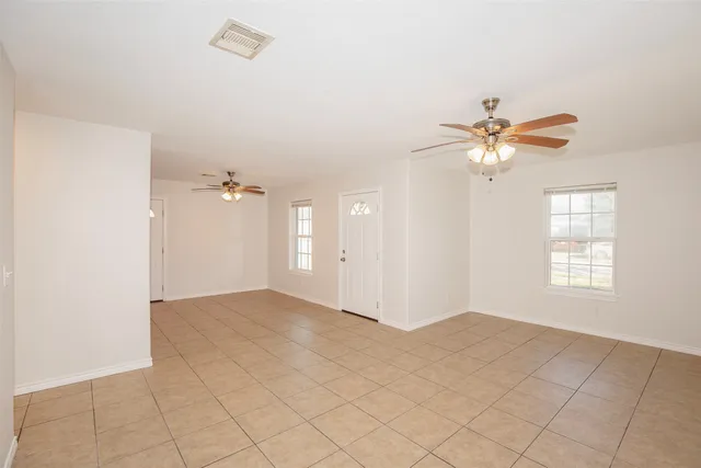 a view of a livingroom with a chandelier fan