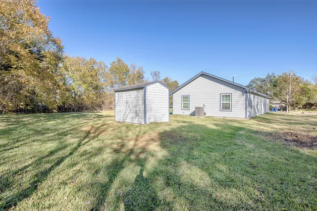 a bathroom with a tub a sink and mirror
