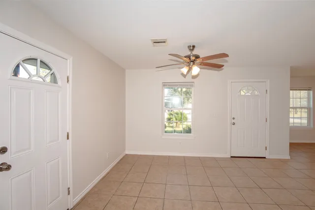 a view of a kitchen with microwave and cabinets