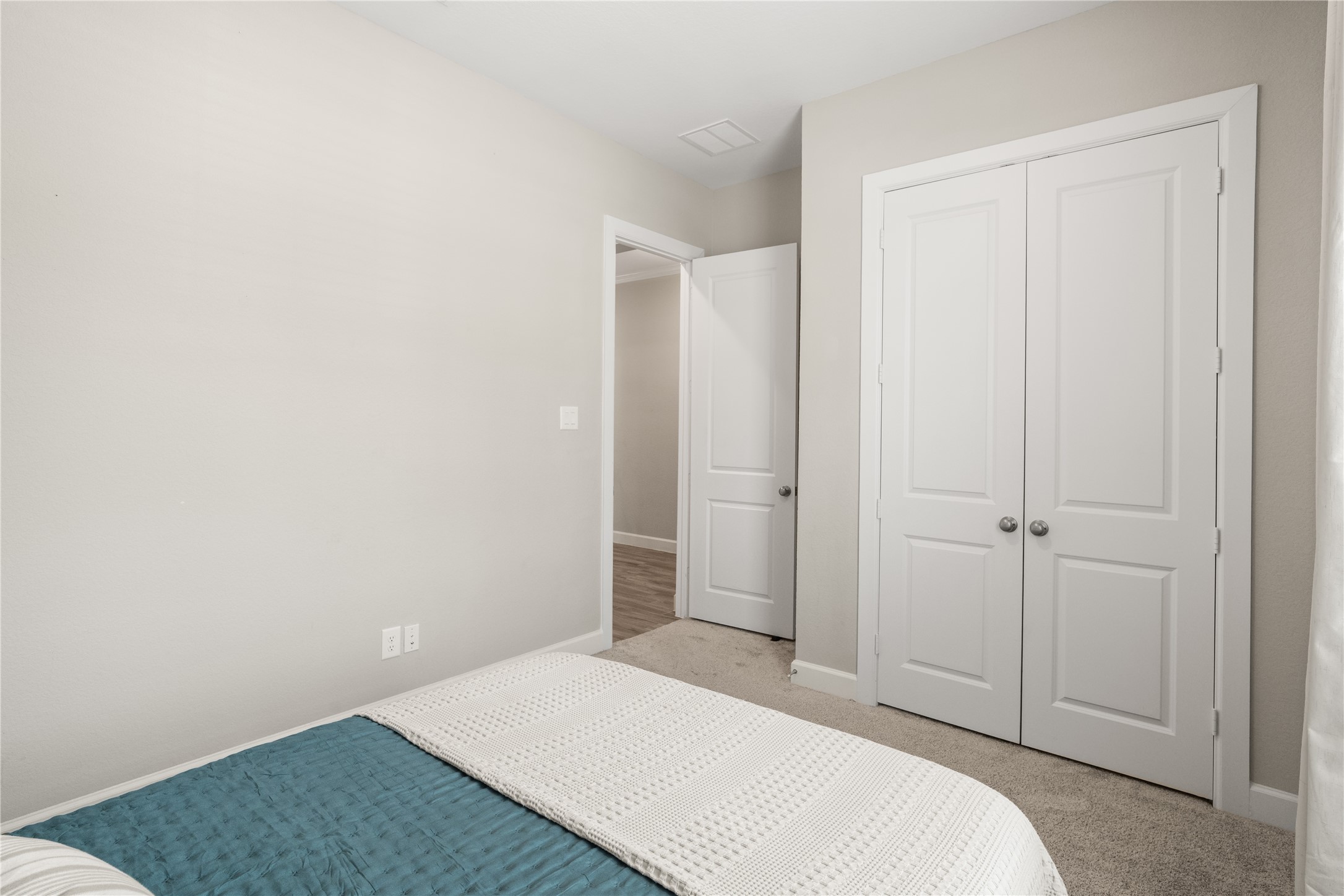3118 Swift Way Katy, TX 77493 - Photo 26 of 34 Bedroom (Alternate View) – A view showcasing the room’s closet and easy access to the hallway, offering practical storage and a functional layout.