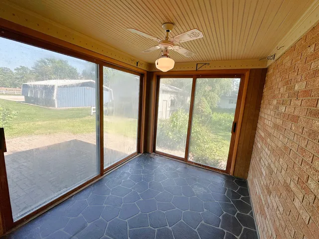 a view of an empty room and window