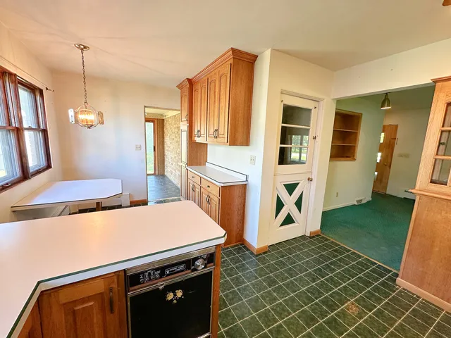 a kitchen that has a sink and a stove