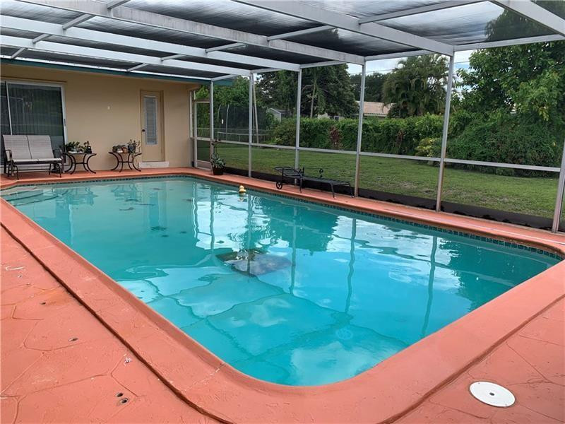 7500 Plantation Road Plantation, FL 33317 - Photo 8 of 12 Full-Sized Screened-In Pool