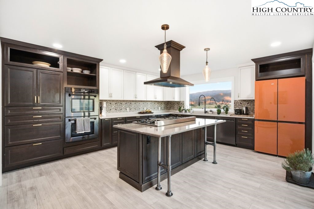 370 Laws Road Limestone, TN 37681 - Photo 20 of 49 a kitchen with a stove and a refrigerator