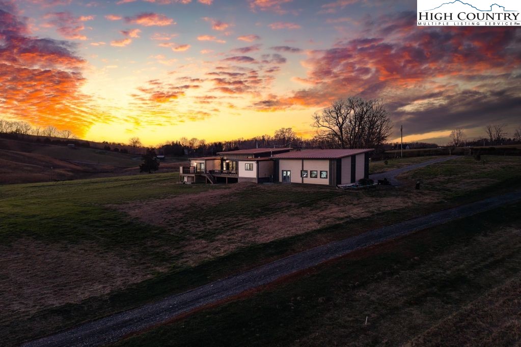 370 Laws Road Limestone, TN 37681 - Photo 2 of 49 a view of house with backyard and garden