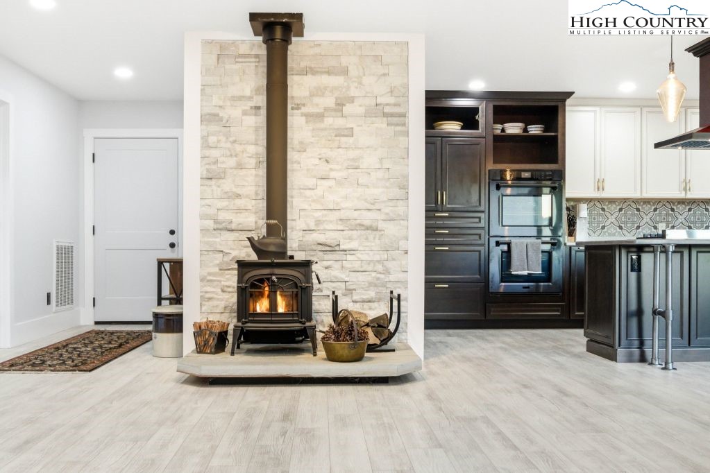 370 Laws Road Limestone, TN 37681 - Photo 21 of 49 a living room with fireplace furniture and a fireplace