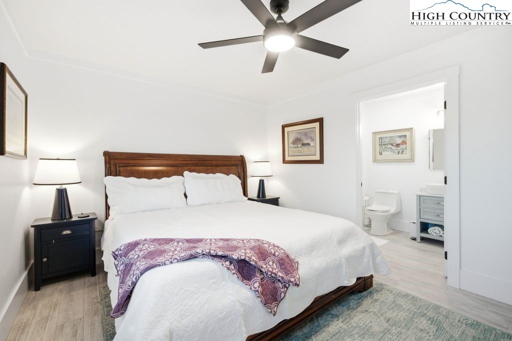 370 Laws Road Limestone, TN 37681 - Photo 34 of 49 a bedroom with a bed and a lamp