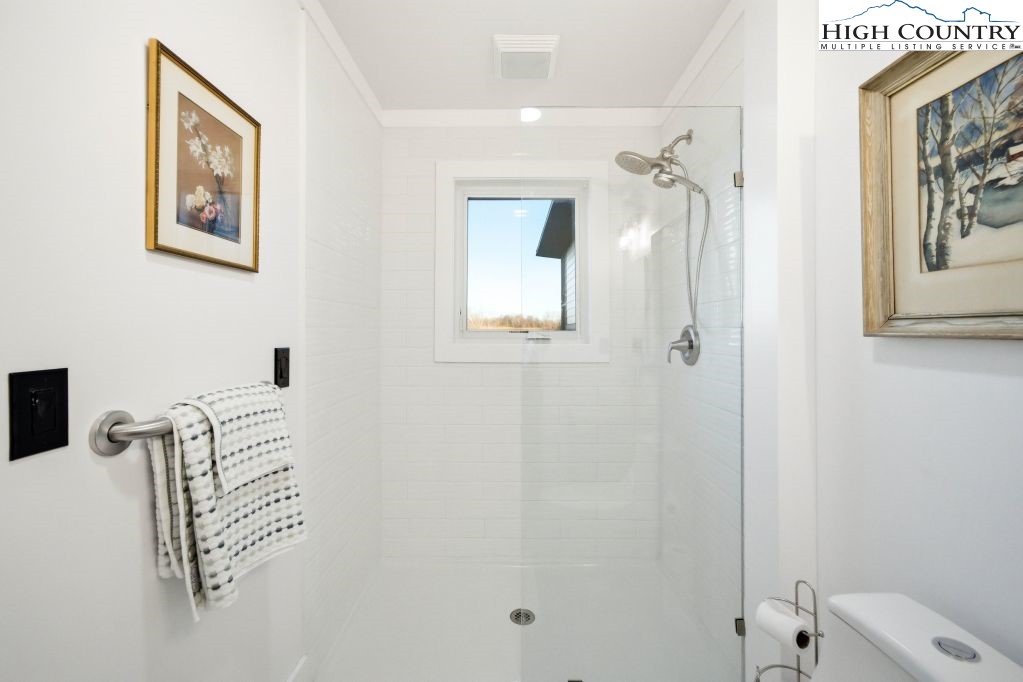 370 Laws Road Limestone, TN 37681 - Photo 36 of 49 a bathroom with a shower and a sink