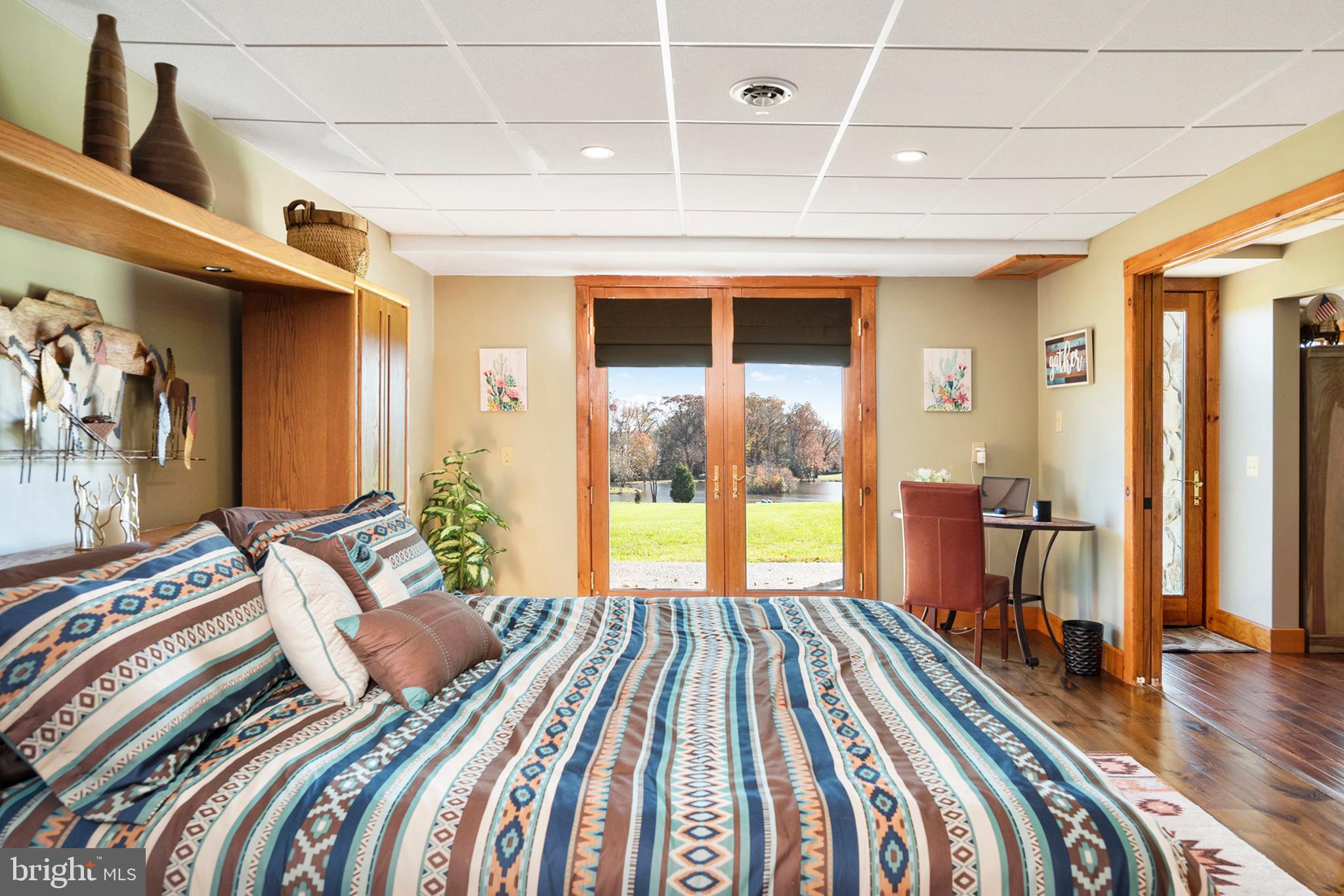 44-2 2 Rivers Road Chesapeake City, MD 21915 - Photo 39 of 62 Lower Level large bedroom, access to patio