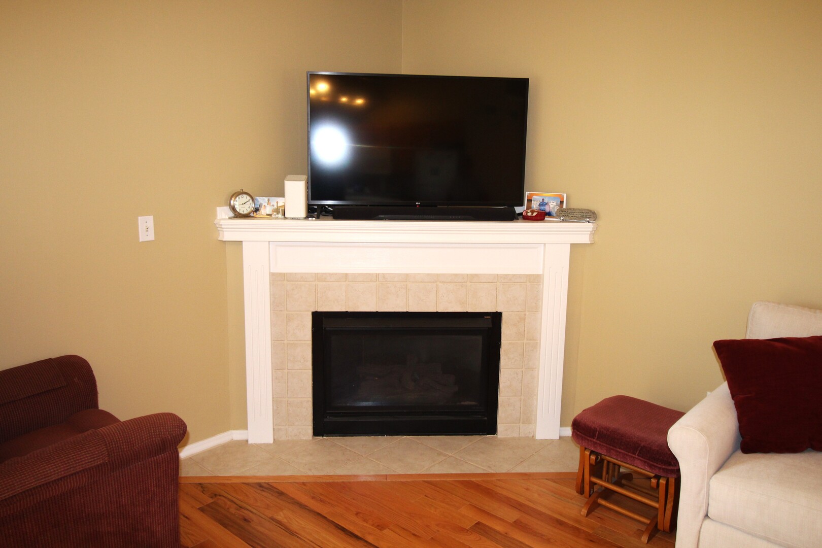 25 Oak Park Road Bloomington, IL 61701 - Photo 9 of 28 a living room with furniture and a fireplace